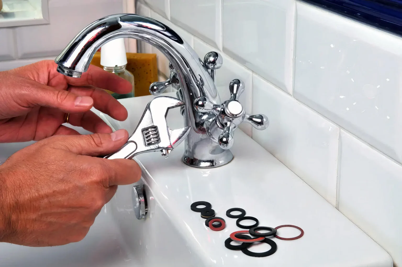 Plumber maintaining a bathroom faucet in Selma