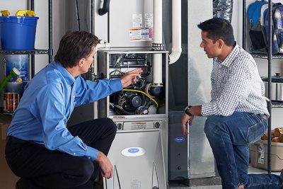 Furnace Repair or Replacement Selma Technician evaluating a furnace for repair or replacement in Selma