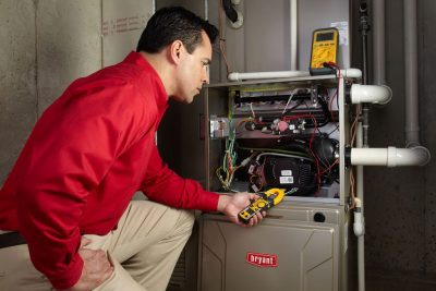 Furnace Repair Selma Heating technician diagnosing a furnace repair in Selma